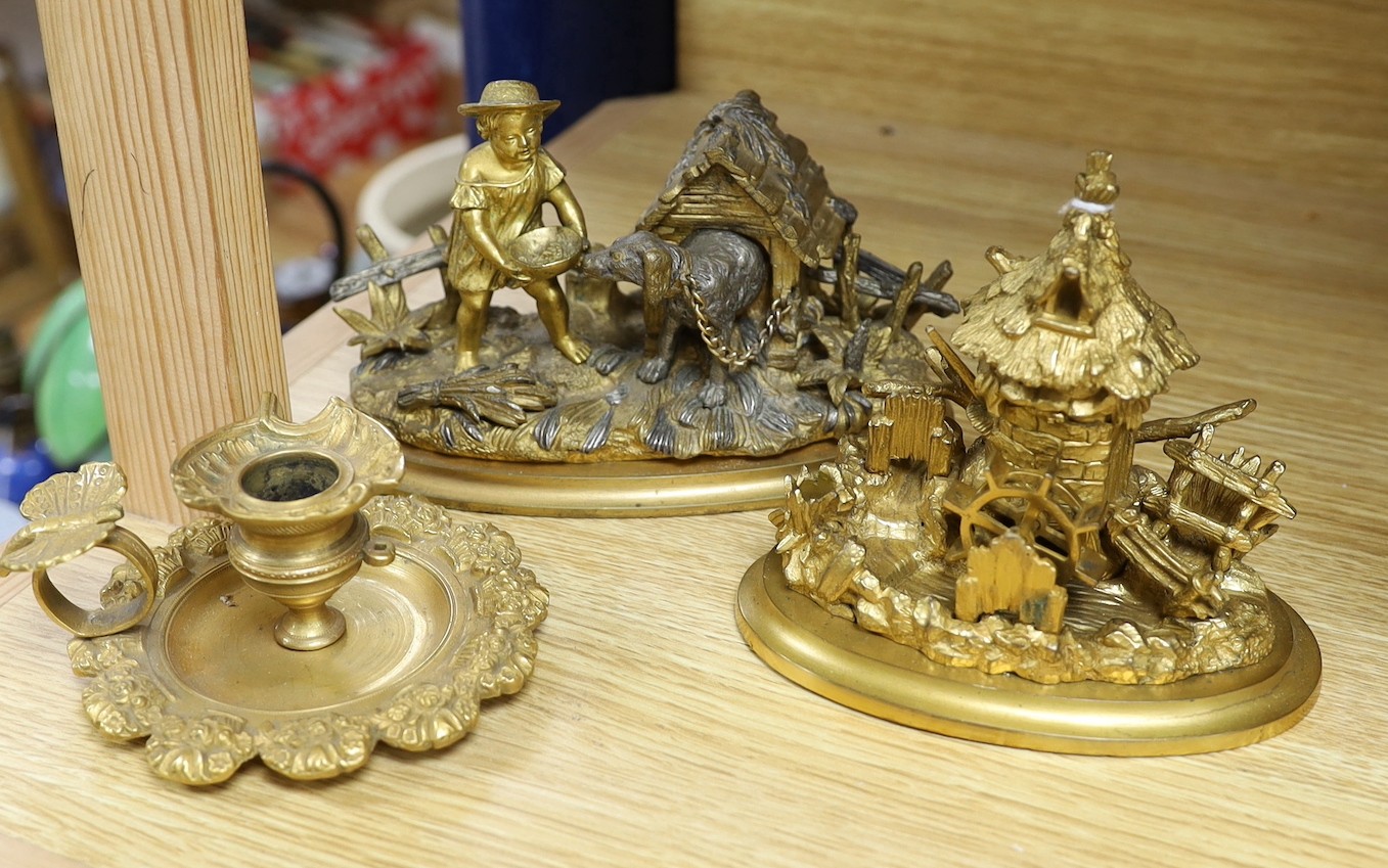 Two 19th century ormolu inkwells, modelled as a dog in a kennel, a water mill together with a chamberstick